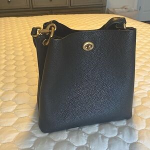 Small coach Crossbody in black with gold hardware